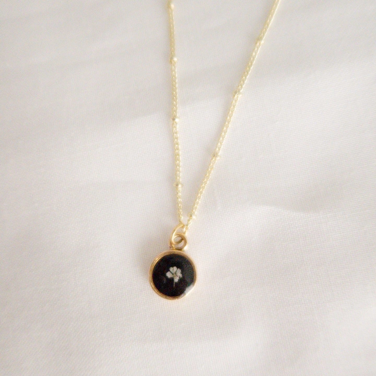 The Tiny Fleur Circle Pendant